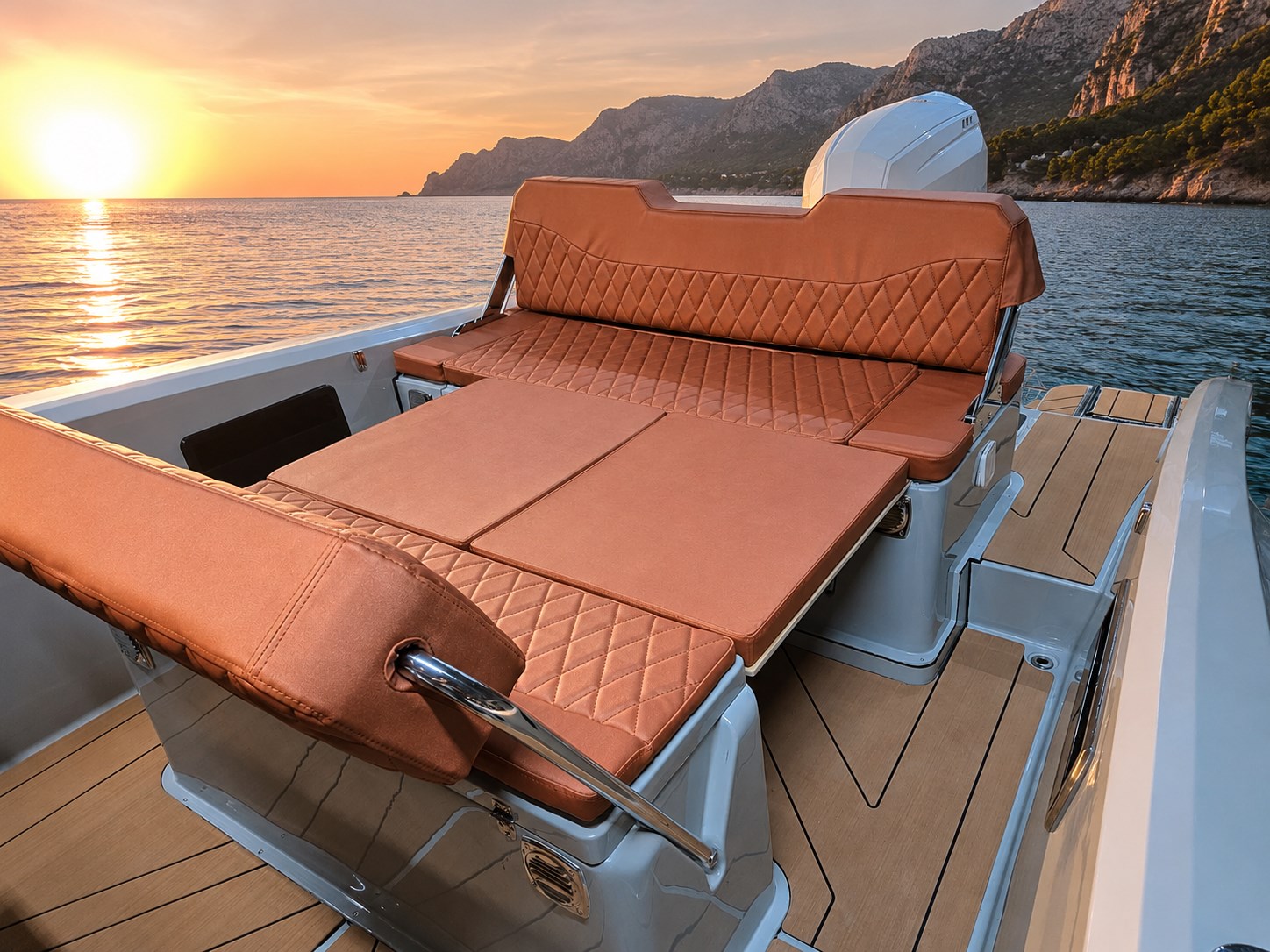 Spacious convertible sunbed aboard the Promotor 600 Sundeck at sunset